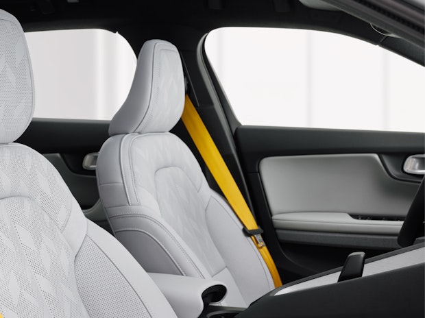 Grey seats and gold seatbelts in the Polestar 2