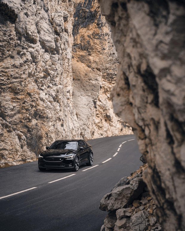 Polestar 2 driving through the mountains