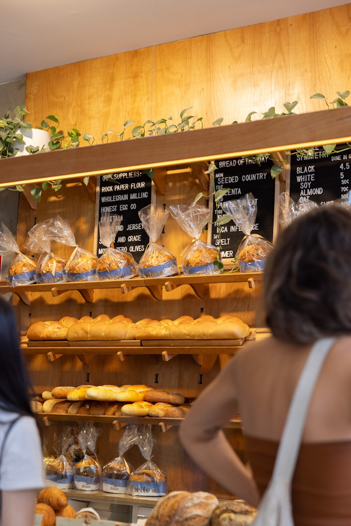 Photograph from inside a bakery. Pasteries on display.