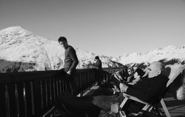 White mountaintops, people enjoying the sun