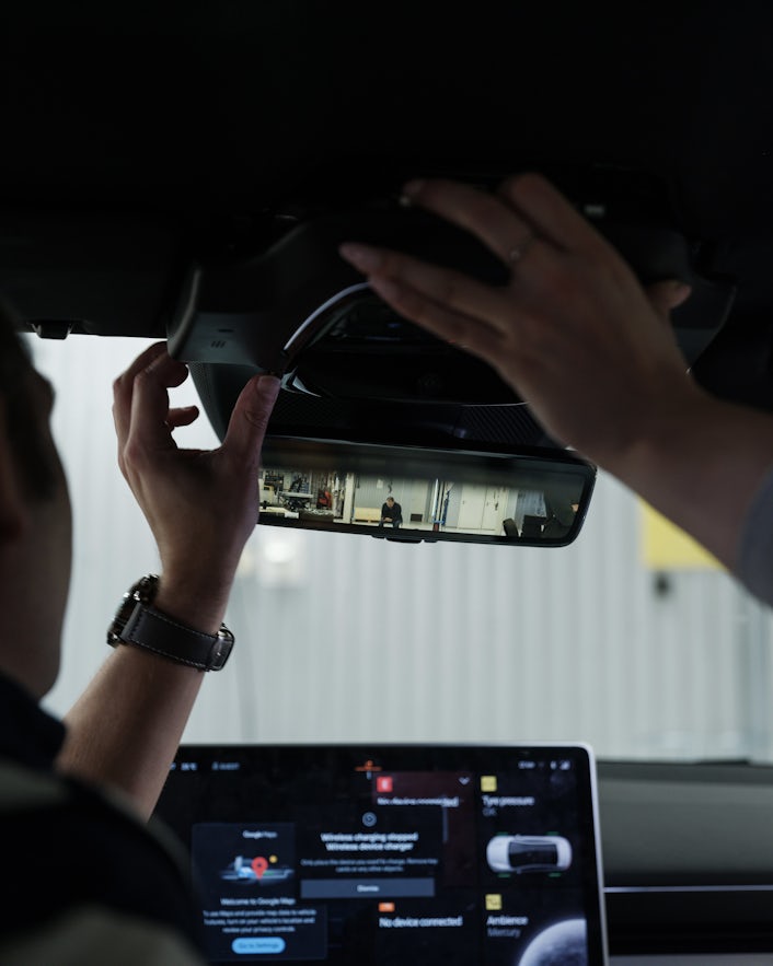 Technicians adding equipment to Polestar 4 rearview mirror