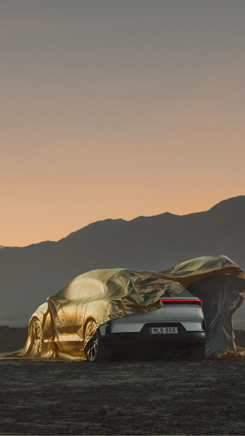 Rear end of Polestar 4 showing from under a golden cover