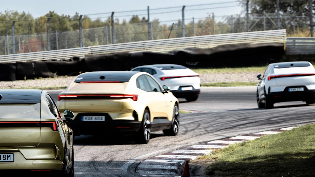 Group of Polestar 4s driving around track