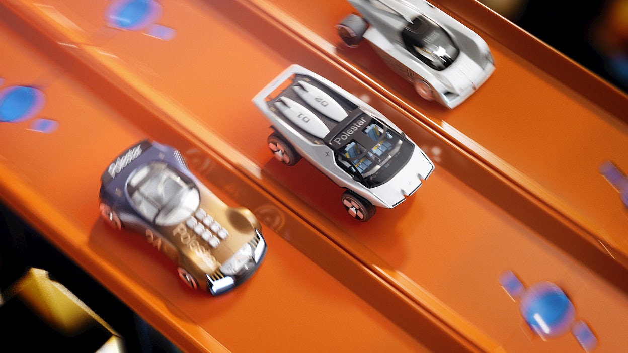 Three toy cars racing on orange track