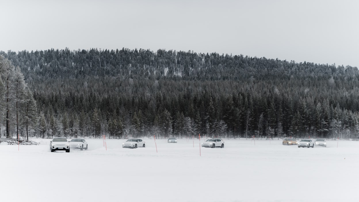 Cars race around frozen track