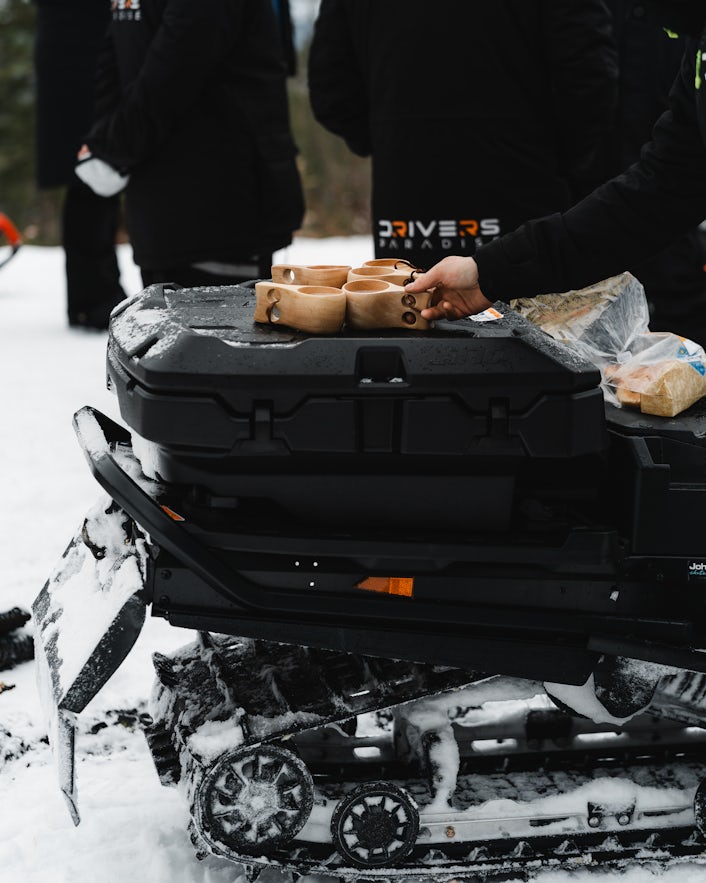 Wooden cups on back of snowmobile