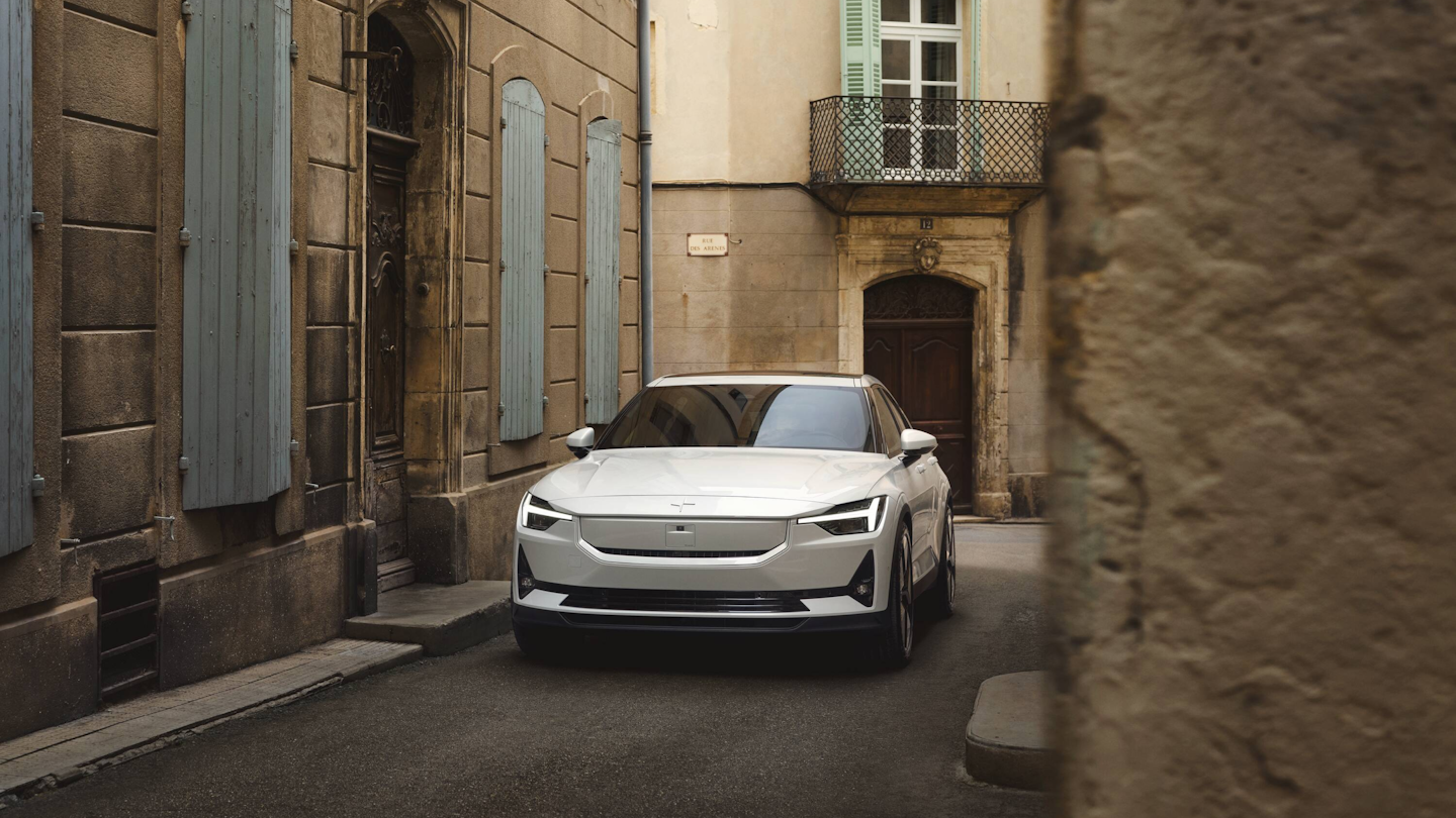 Polestar 2 pictured from the front in a narrow French street